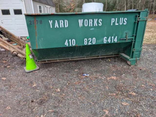 10 yard roll-off dumpster in a residential driveway in Easton Maryland