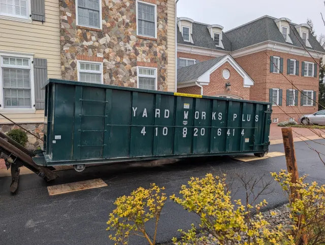 Yard Works Plus 30 yard dumpster at a townhouse community